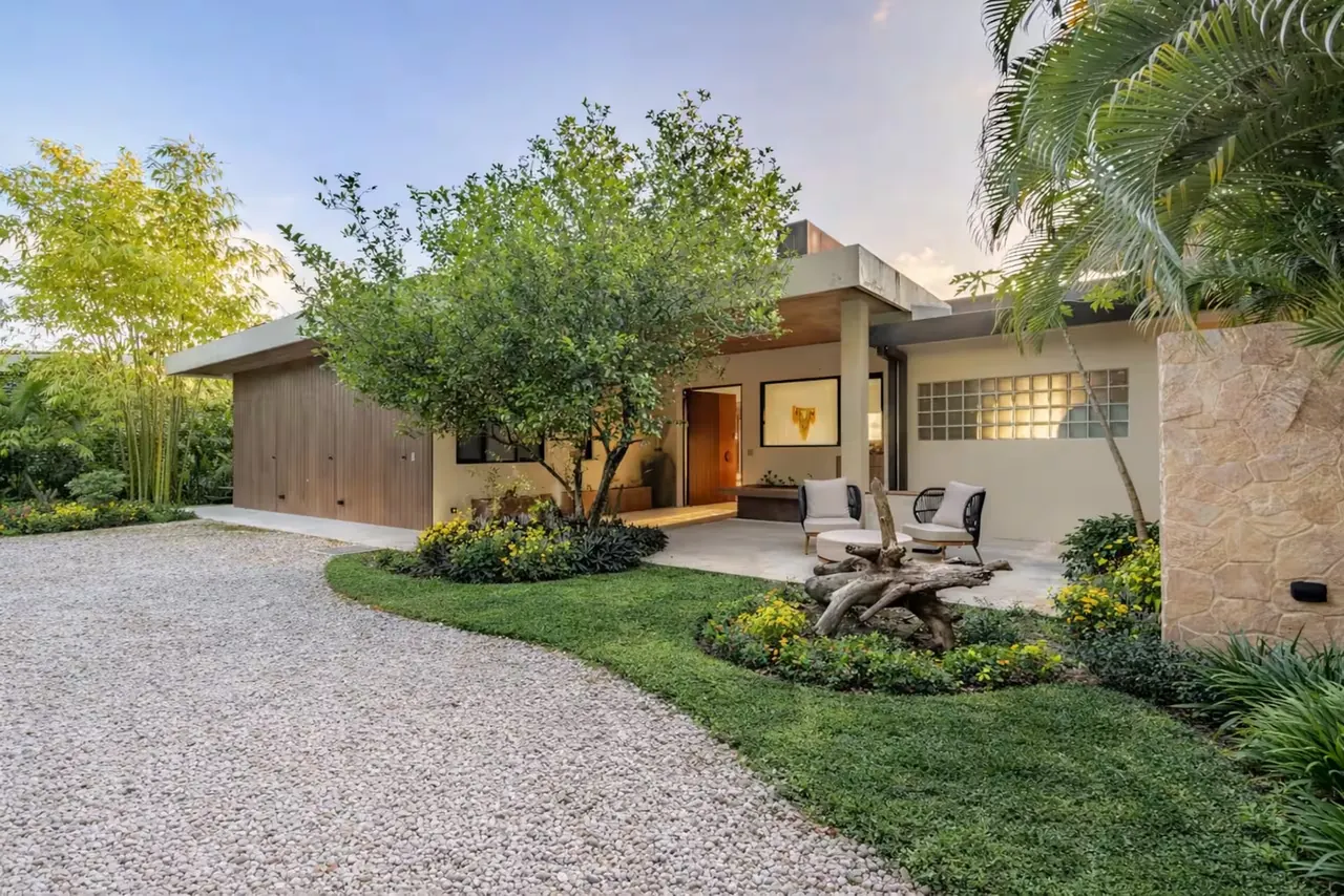 Garden courtyard and entry to Villa Raya surrounded by mature trees