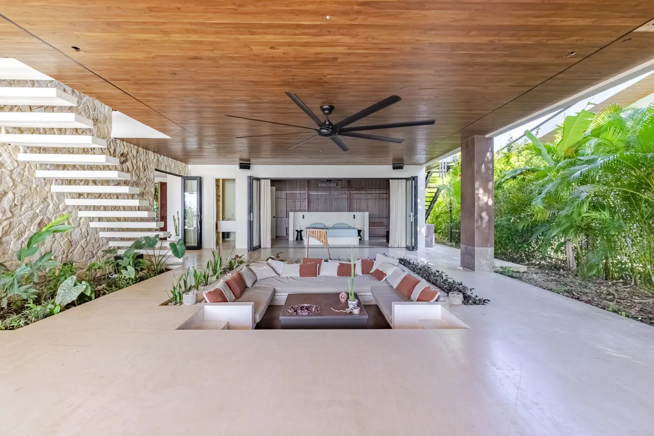 Sunken seating area beneath the terrace ceiling and open staircase